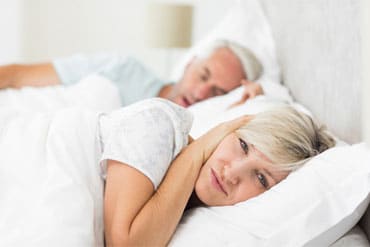 woman stopping snoring because of sleep apnea